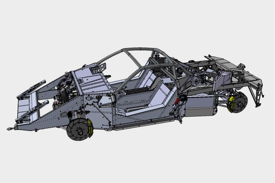 Шасси Maruissia B1. Хорошо виден монокок с интегрированным трубчатым каркасом и крепившиеся к нему передний и задний подрамники. Вырез перед пассажиром сделан под подушку безопасности.

